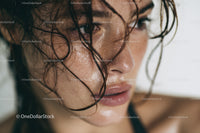 Close-up of Freckled Woman with Wet Hair and Moist Skin