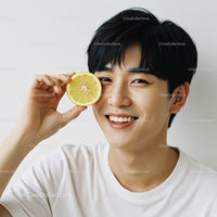 Happy Young Man with Lemon Slice Portrait Bright Fresh Citrus Lifestyle