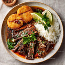 Savory Grilled Fish with Rice and Fresh Lime Garnish