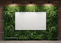 Modern blank whiteboard surrounded by lush greenery