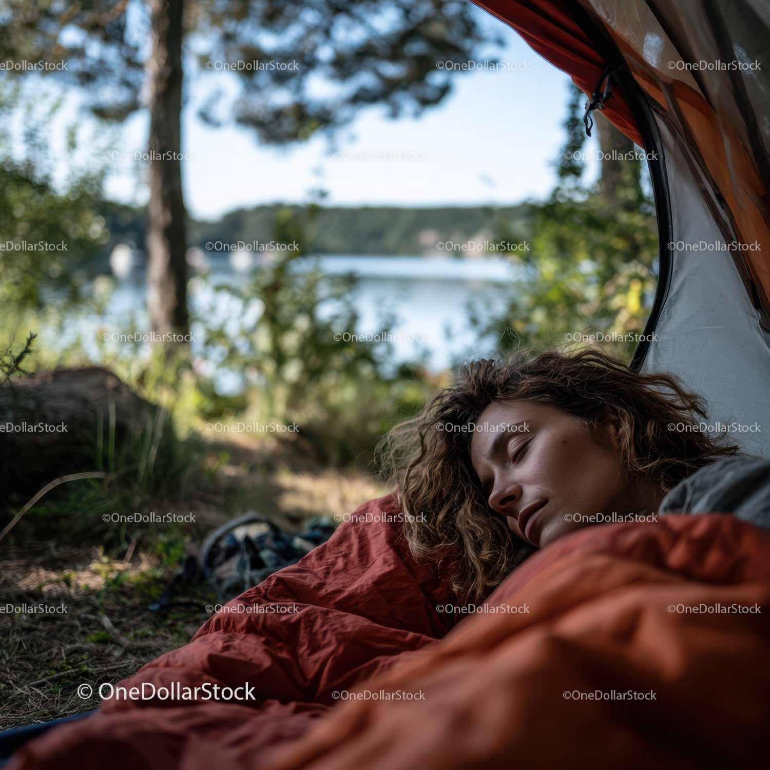 Woman Sleeping Relaxed in Red Sleeping Bag by Forest Lake