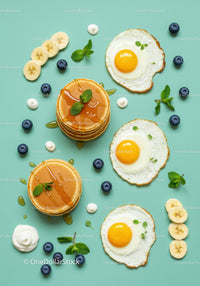 Sunny side up eggs with pancakes and fresh fruits