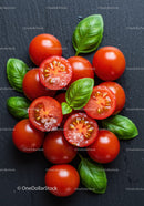 Fresh cherry tomatoes with basil leaves on dark background