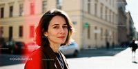 Confident woman enjoying sunny urban stroll