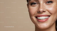 Close up of happy young woman with natural freckles smile