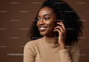 Elegant Smiling African American Woman with Curly Hair in Brown Studio