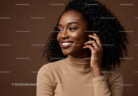 Elegant Smiling African American Woman with Curly Hair in Brown Studio
