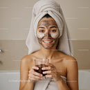 Young Woman Enjoying Facial Mask Treatment with Towel Wrap