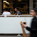 Friends enjoying coffee at an outdoor cafe on a casual day