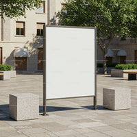 Blank outdoor billboard in quiet urban square