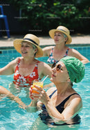 Elderly Women Relaxing and Drinking Refreshing Drinks in Pool