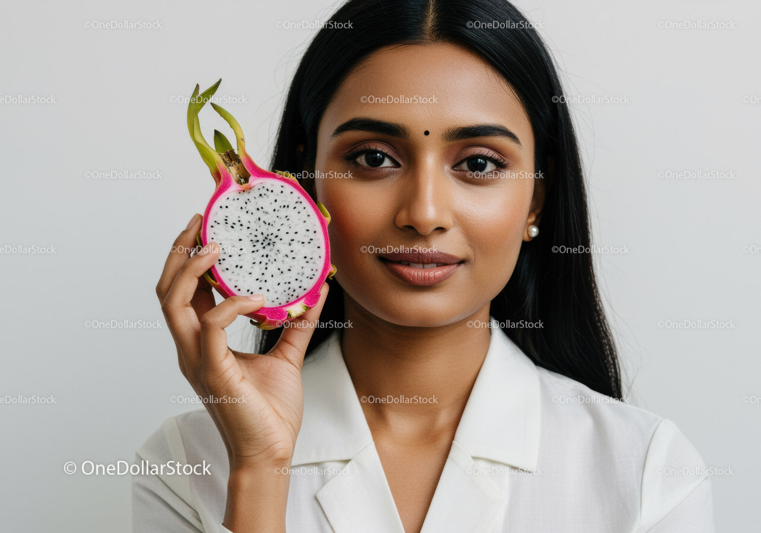 Young Woman with Exotic Dragon Fruit in a Minimalistic Studio