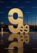 Large 9 99 Number Sculpture by Waterfront at Dusk