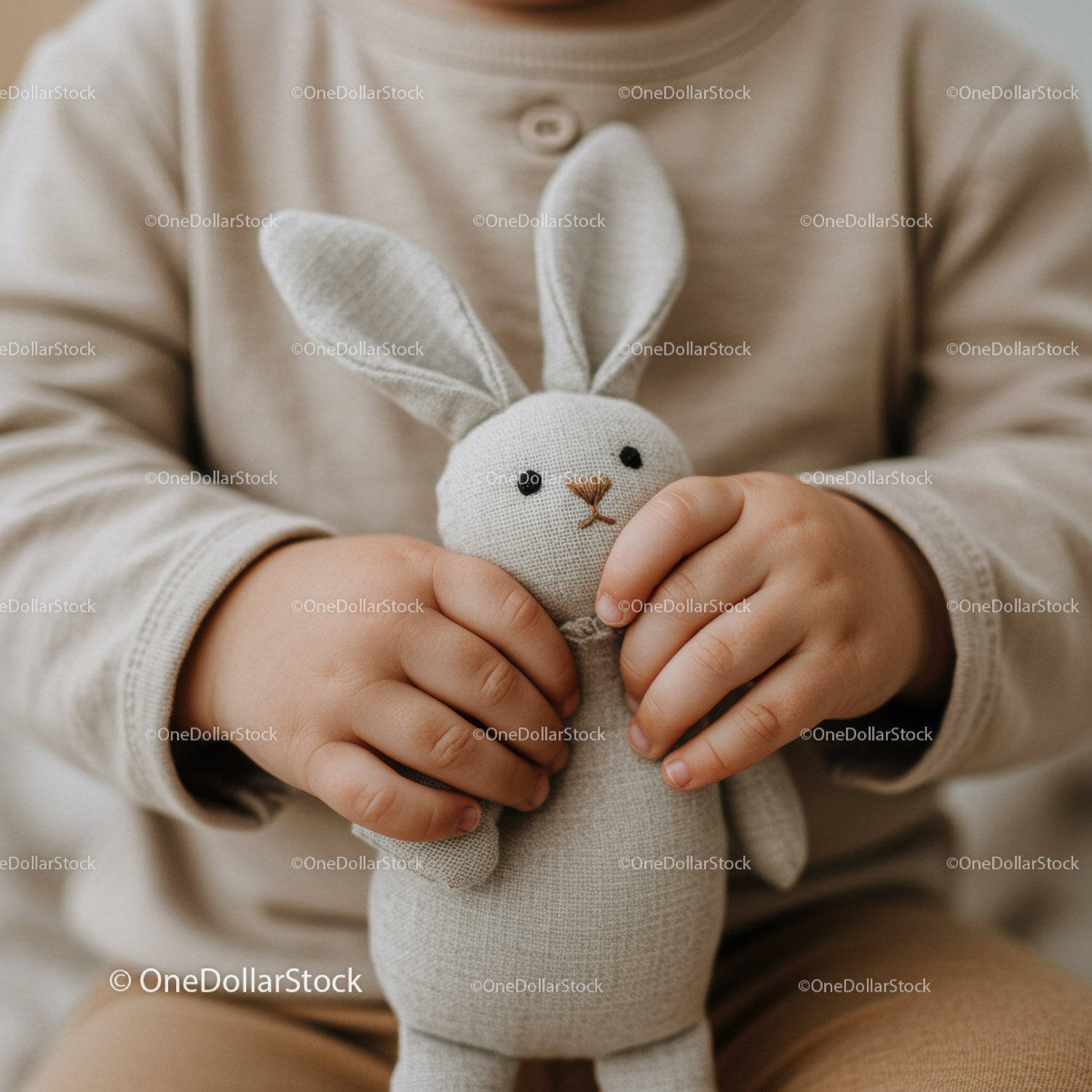 Child Holding Soft Fabric Bunny Toy with Care