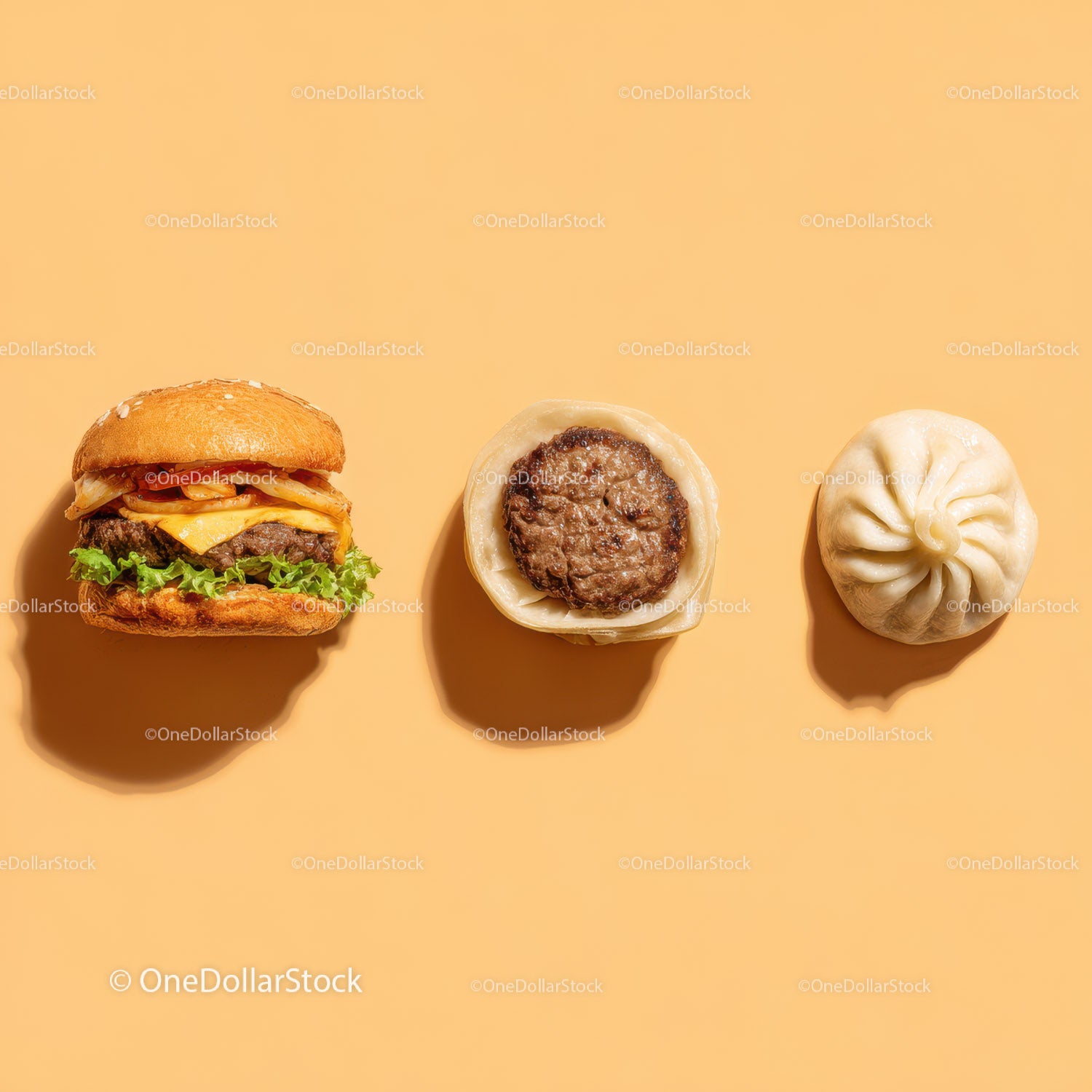 Gourmet Burger with Lettuce and Tomato Next to Grilled Steak and Dumpling