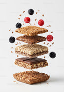 Stacked granola bars with chocolate and fresh berries