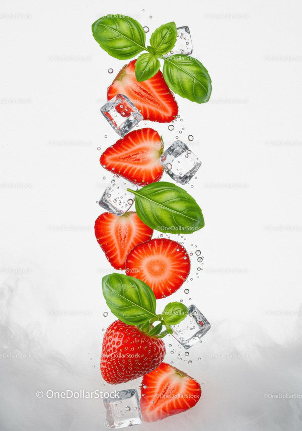 Fresh strawberry slices and basil leaves with ice cubes