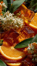 Vibrant Orange Slices with Ice Cubes and Flora in Bright Composition