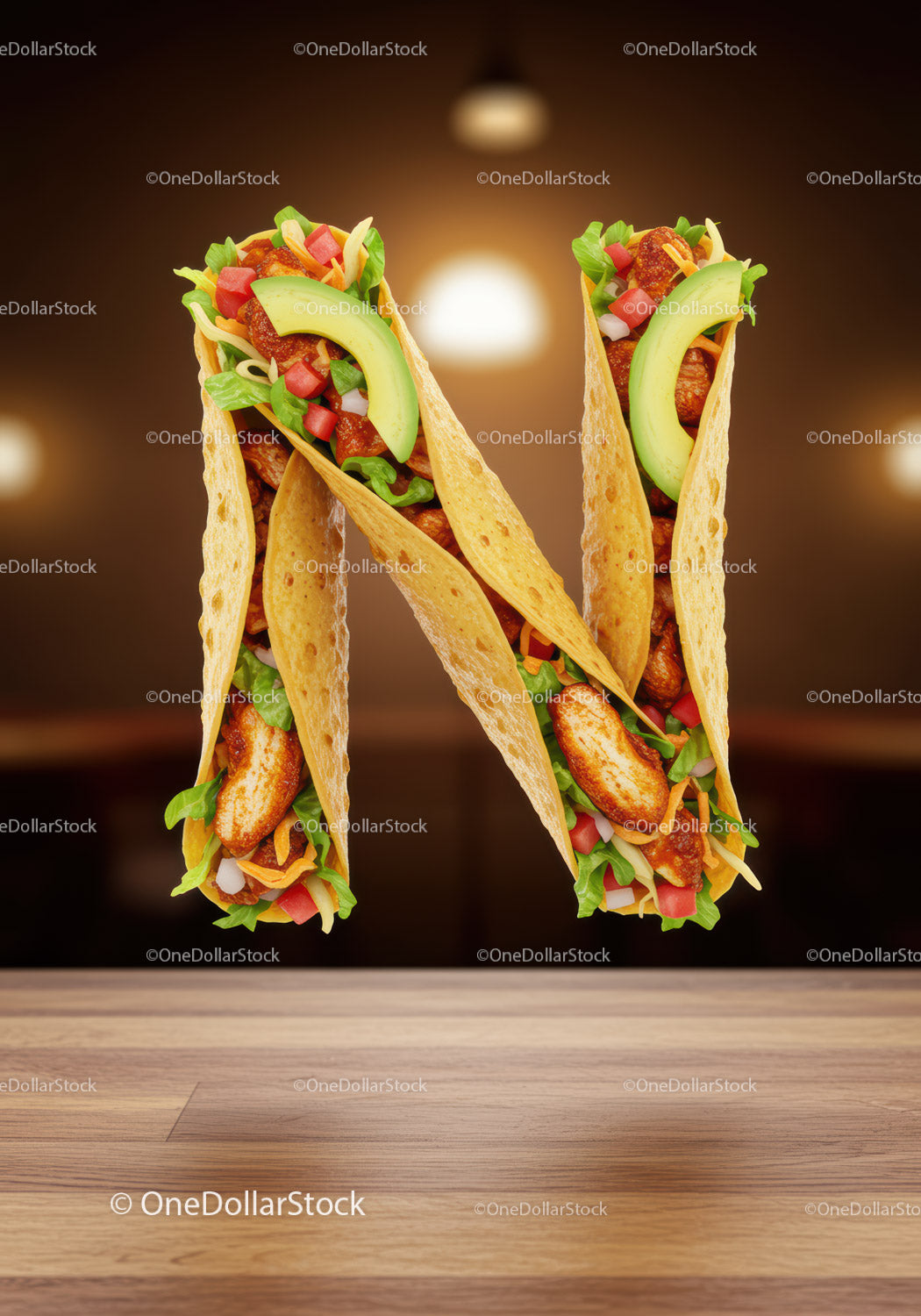 Litera N utworzona przez tacos z kurczakiem i świeżymi warzywami