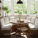 Cozy breakfast nook with natural light and greenery