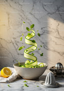 Fresh cucumber ribbons and herbs in rustic bowl