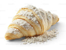 Golden Croissant with Powdered Sugar on White Background