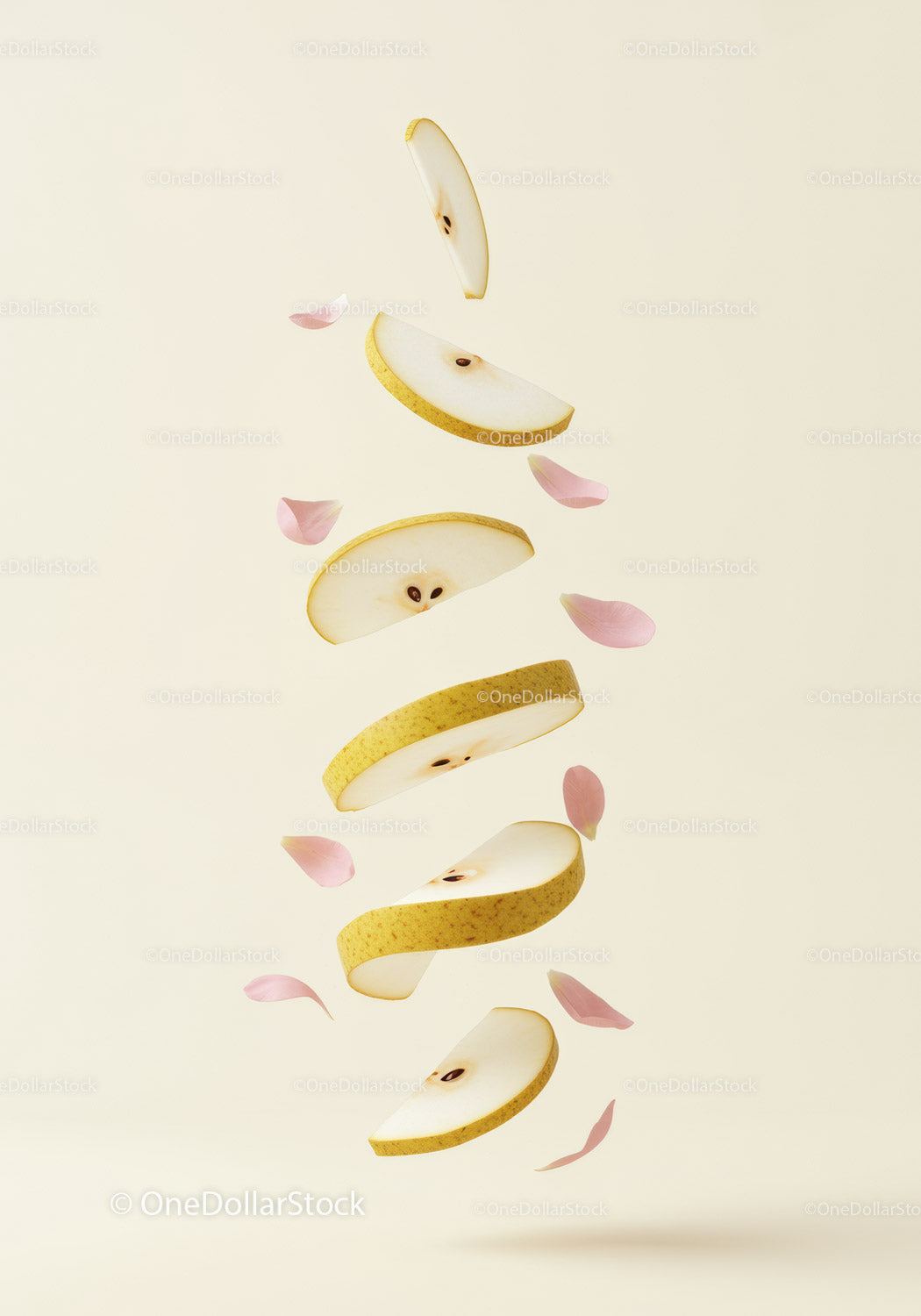 Floating slices of pear with delicate pink petals
