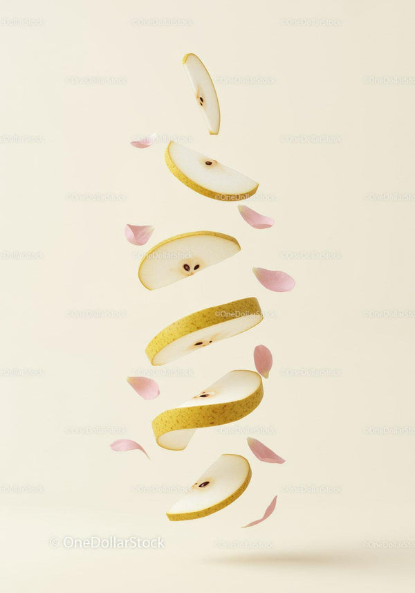 Floating slices of pear with delicate pink petals