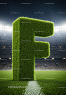 Letter F shaped from vibrant green grass on soccer field