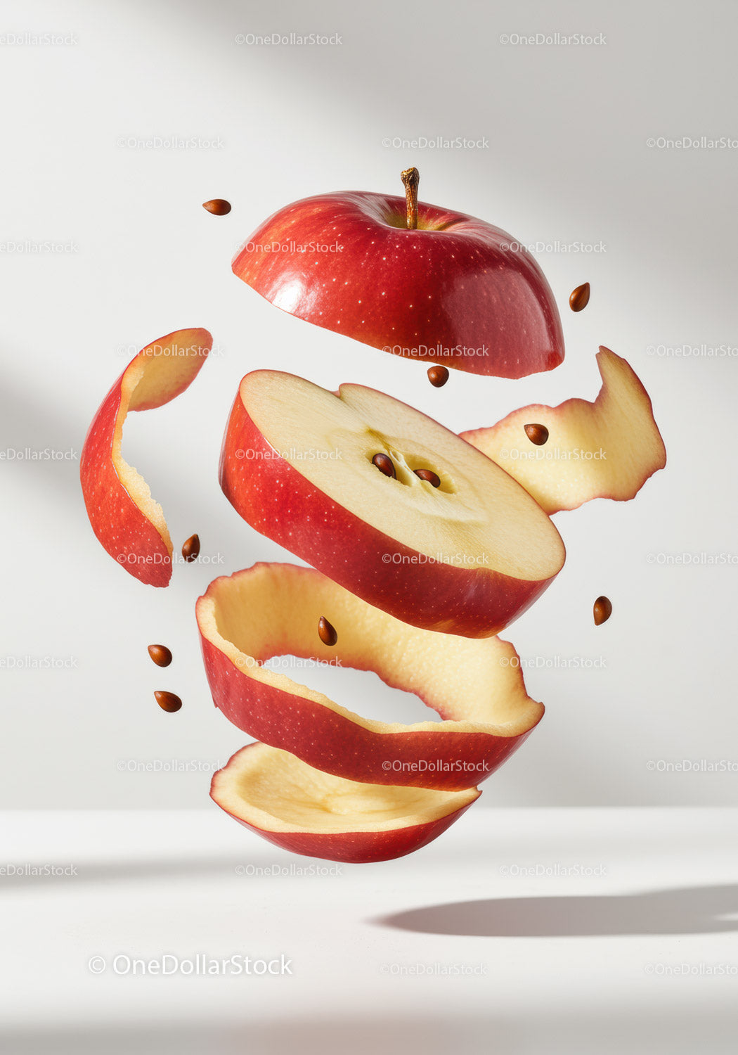 Floating Red Apple with Peeling and Seeds in Air
