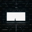 Silhouette of man walking across empty theater stage