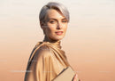 Elegant Woman with Short Silver Hair Wearing Beige Silk Blouse