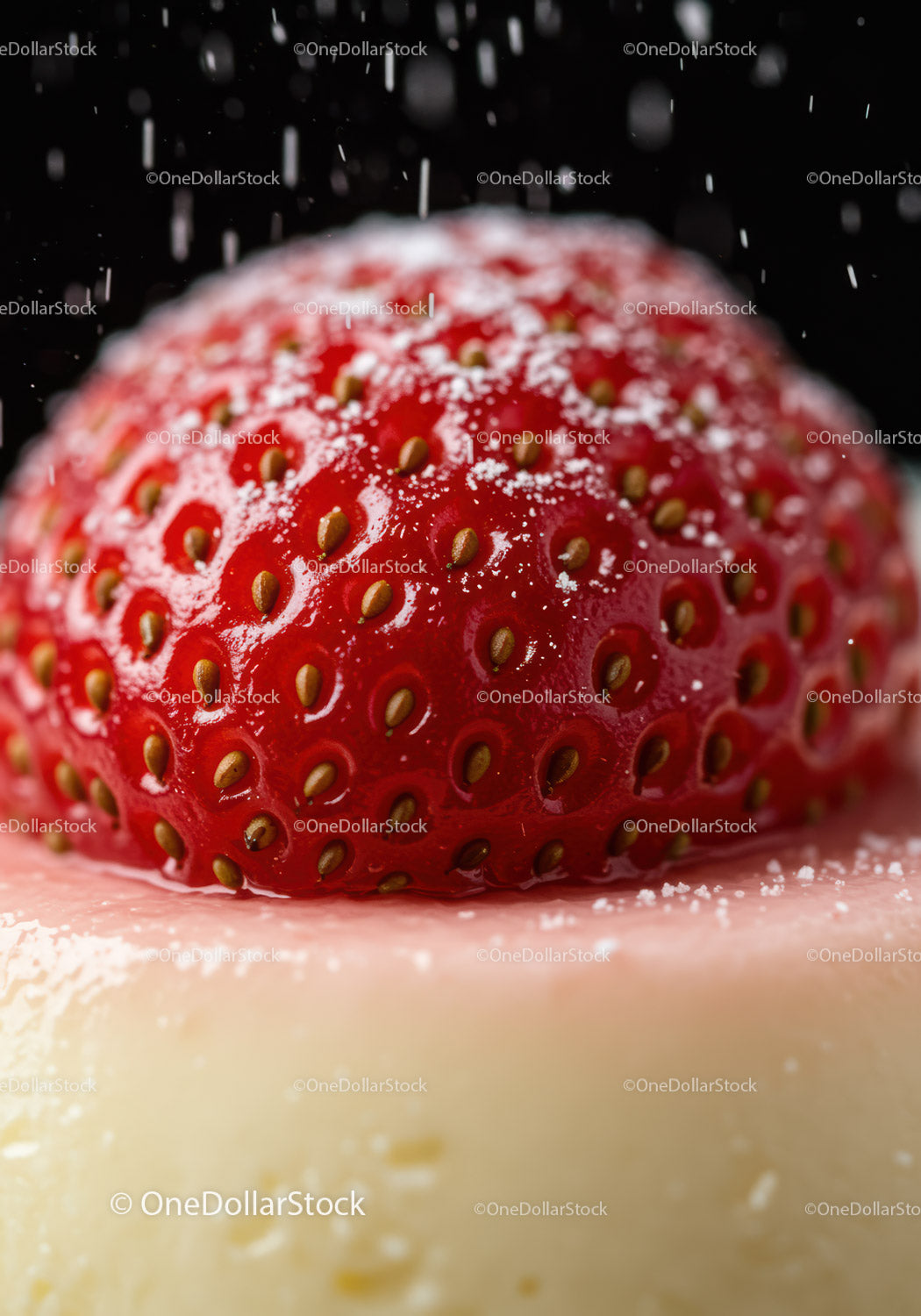 Close up of fresh strawberry with powdered sugar on dessert