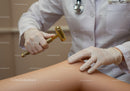 Doctor Using Reflex Hammer During Medical Examination