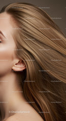 Close up of woman with flowing shiny blonde hair