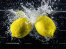 Fresh Yellow Lemons Splashing into Water Creating Vibrant Juicy Effect