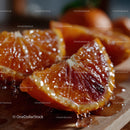 Close-up of Juicy Blood Orange Slices on Wooden Surface for Healthy Snacking