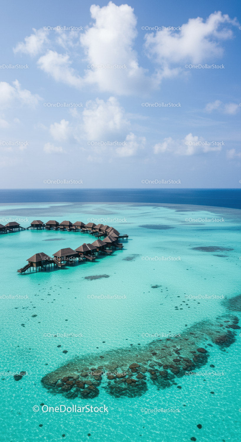 Stunning Overwater Bungalows over Turquoise Ocean Under Blue Sky