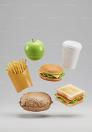Assorted Fast Food Items with Fresh Green Apple Floating