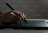 Hand Holding Stylus Pen on Digital Drawing Tablet for Artistic Creation