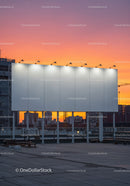 City Skyline with Construction Cranes and Sunset Sky