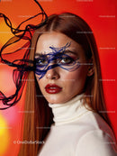 Striking Woman with Artistic Blue Face Paint and Red Lipstick