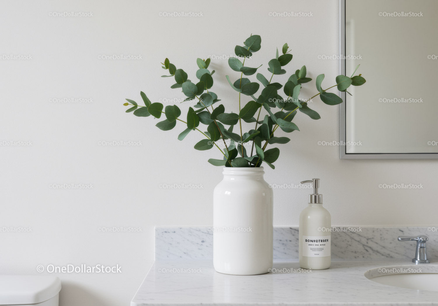 Elegant Green Foliage in White Vase on Marble Bathroom Counter