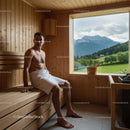 Man Relaxing in Sauna with Mountain View and Wooden Interior