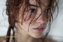 Close-up of a Woman with Wet Hair and Freckles