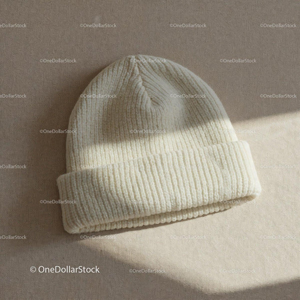 Cozy cream knit beanie on neutral fabric background JPG Mockup Image