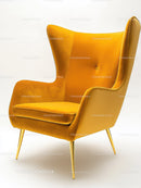 Stylish Orange Velvet Armchair with Gold Legs for Modern Interiors