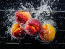 Juicy Peaches and Apricots Splashing into Water