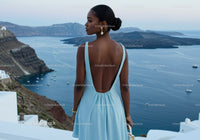 Woman in Light Blue Dress Overlooking Ocean View