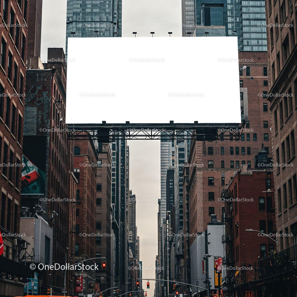 Empty billboard over busy city street between tall buildings JPG Mockup Image